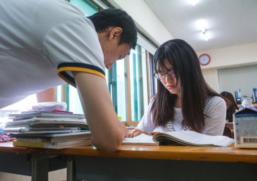 North korean teen defector with her teatcher in yeo-mung alternative school, National capital area, Seoul, South korea