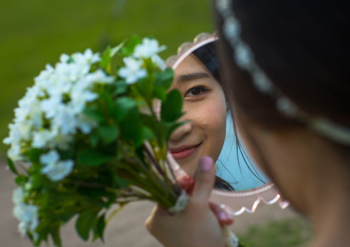 South korean woman called juyeon looking at herself in a mirror, Sudogwon, Paju, South korea