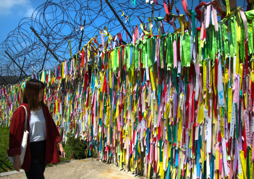 Messages of peace and unity written on ribbons left on fence at DMZ, North Hwanghae Province, Panmunjom, South Korea