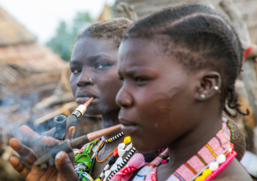 Toposa tribe women smoking pipes, Namorunyang State, Kapoeta, South Sudan