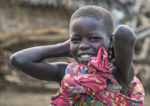 Smiling Toposa tribe girl in a village, Namorunyang State, Kapoeta, South Sudan