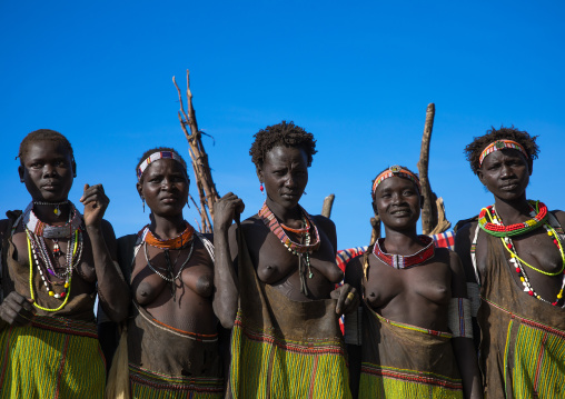 Toposa tribe women in traditional clothing during a ceremony, Namorunyang State, Kapoeta, South Sudan