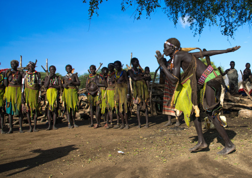 Toposa tribe women in traditional clothing dancing during a ceremony, Namorunyang State, Kapoeta, South Sudan