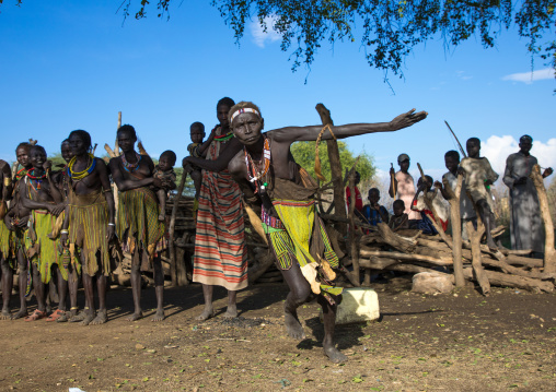 Toposa tribe women in traditional clothing dancing during a ceremony, Namorunyang State, Kapoeta, South Sudan