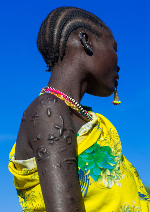 Larim tribe woman with scarifications on her body, Boya Mountains, Imatong, South Sudan