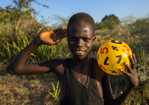 Portrait of a Larim tribe boy saluting with the hand, Boya Mountains, Imatong, South Sudan