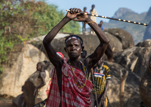 Larim tribe woman dancing during a wedding celebration, Boya Mountains, Imatong, South Sudan