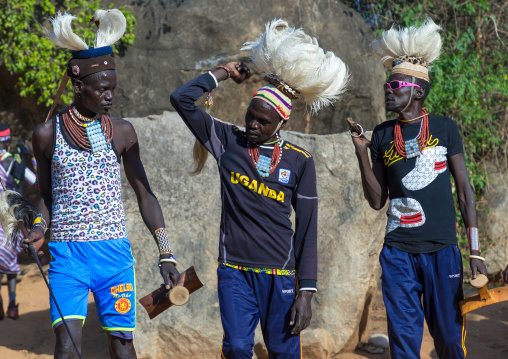 Larim tribe men dancing during a wedding ceremony, Boya Mountains, Imatong, South Sudan