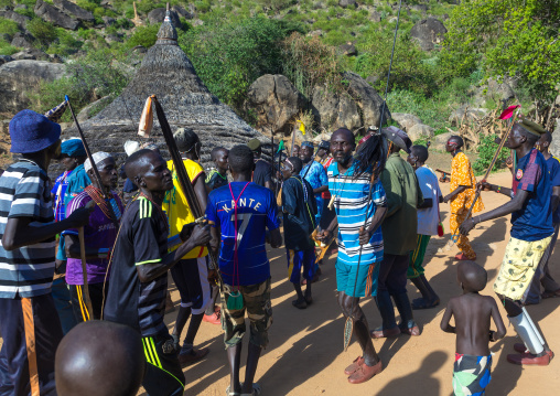 Larim tribe men dancing during a wedding ceremony, Boya Mountains, Imatong, South Sudan