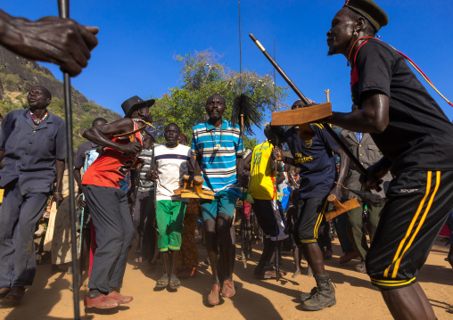 Larim tribe men dancing during a wedding ceremony, Boya Mountains, Imatong, South Sudan