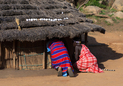 Women entering in a Larim tribe house, Boya Mountains, Imatong, South Sudan