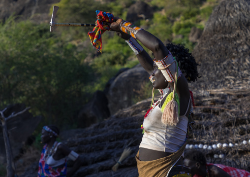 Larim tribe woman dancing during a wedding celebration, Boya Mountains, Imatong, South Sudan