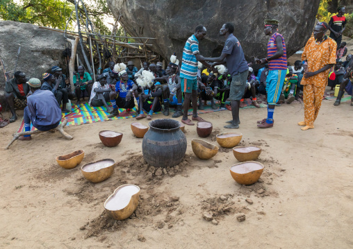 Larim tribe men drinking alcohol during a wedding ceremony, Boya Mountains, Imatong, South Sudan