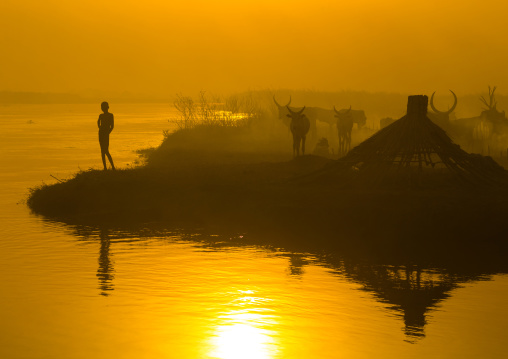 Mundari tribe child on the bank of river Nile at sunset, Central Equatoria, Terekeka, South Sudan