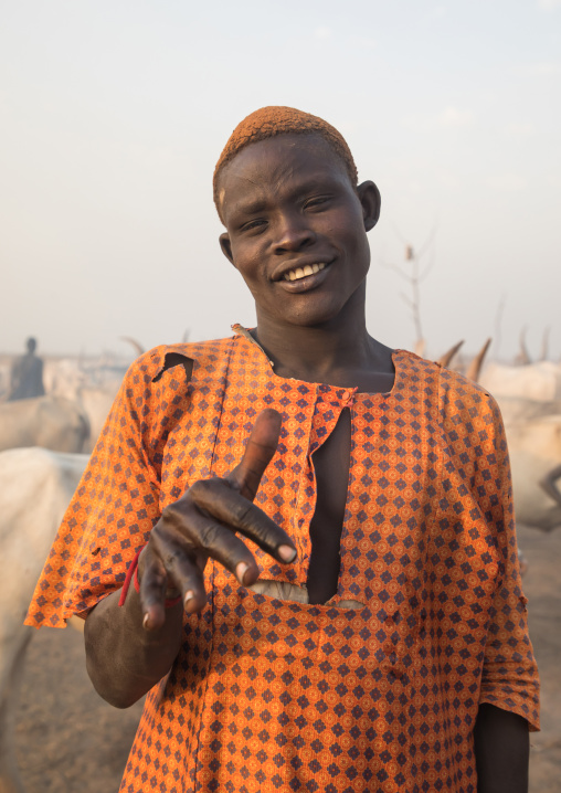 Portrait of a Mundari tribe man with hair dyed in orange with cow urine, Central Equatoria, Terekeka, South Sudan