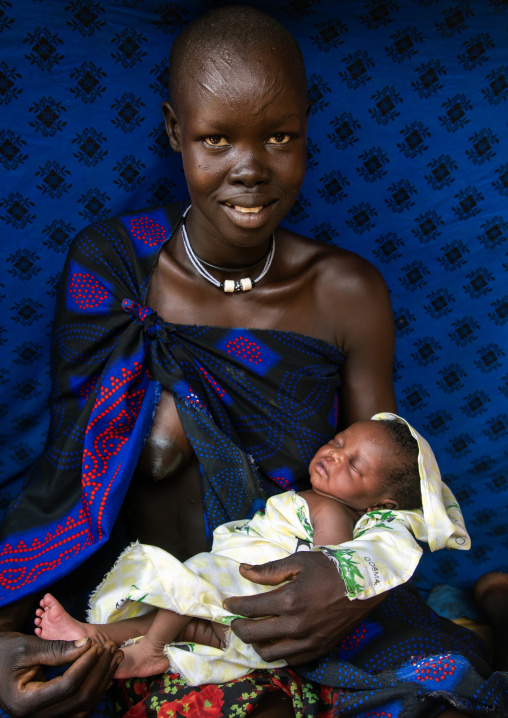 Portrait of a Mundari tribe mother with scarifications on the forehead, Central Equatoria, Terekeka, South Sudan