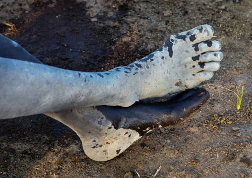 Mundari tribe man feet covered in ash, Central Equatoria, Terekeka, South Sudan