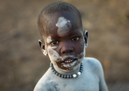 Mundari tribe boy covered in ash to protect from the mosquitoes and flies, Central Equatoria, Terekeka, South Sudan