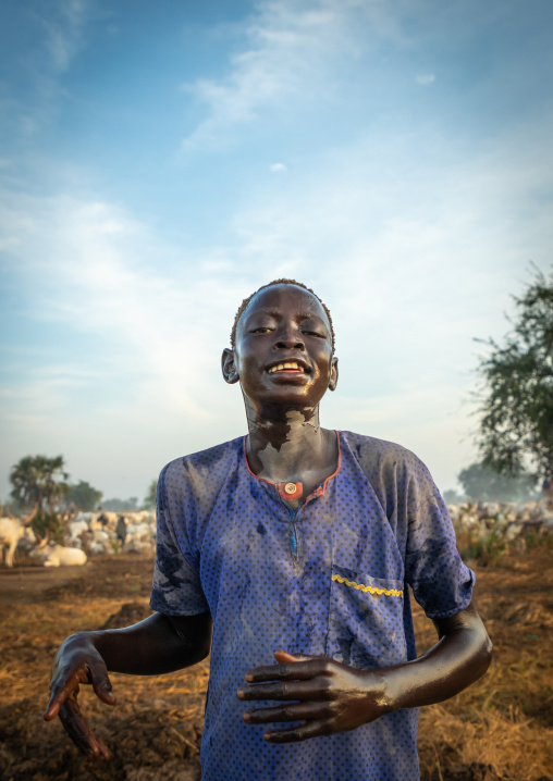 Mundari tribe boy showering with cow urine to take advantage of the antibacterial properties, Central Equatoria, Terekeka, South Sudan