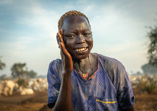 Mundari tribe boy showering with cow urine to take advantage of the antibacterial properties, Central Equatoria, Terekeka, South Sudan