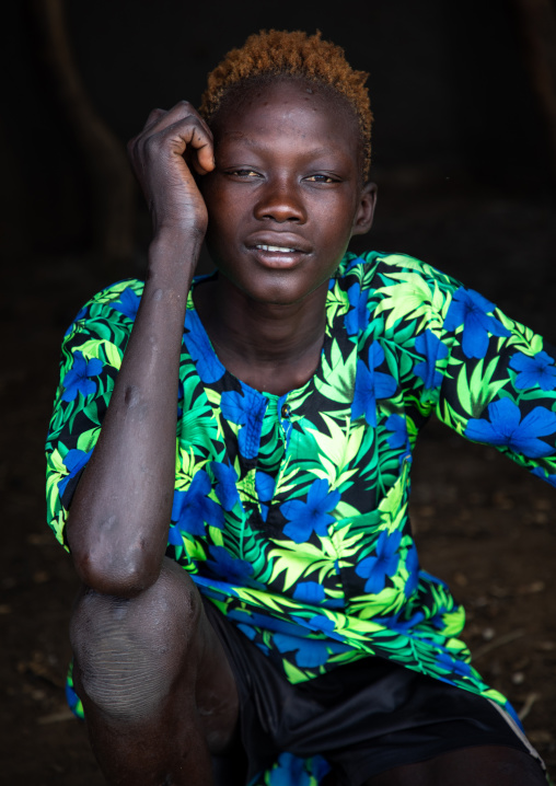 Portrait of a Mundari tribe man with hair dyed in orange with cow urine, Central Equatoria, Terekeka, South Sudan