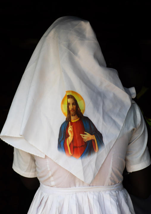 Mundari tribe nun with jesus christ on her veil during a sunday mass in a church, Central Equatoria, Terekeka, South Sudan