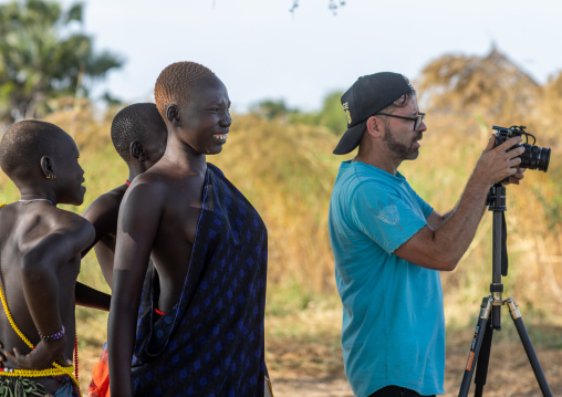 Tourist taking pictures in Mundari tribe, Central Equatoria, Terekeka, South Sudan