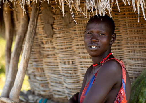 Portrait of a Mundari tribe woman under her house roof, Central Equatoria, Terekeka, South Sudan