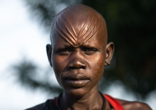 Portrait of a Mundari tribe woman with scarifications on the forehead, Central Equatoria, Terekeka, South Sudan