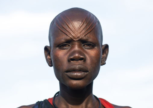 Portrait of a Mundari tribe woman with scarifications on the forehead, Central Equatoria, Terekeka, South Sudan