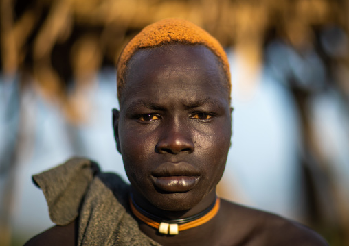 Portrait of a Mundari tribe man with hair dyed in orange with cow urine, Central Equatoria, Terekeka, South Sudan