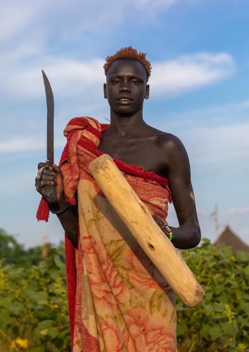 Portrait of a Mundari tribe man with hair dyed in orange with cow urine, Central Equatoria, Terekeka, South Sudan