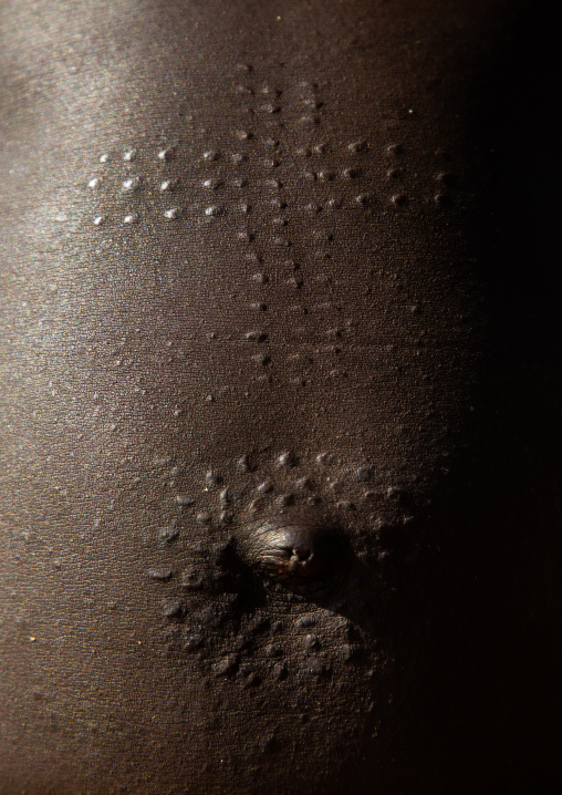 Mundari tribe woman scarifications on the belly in a cross shape, Central Equatoria, Terekeka, South Sudan