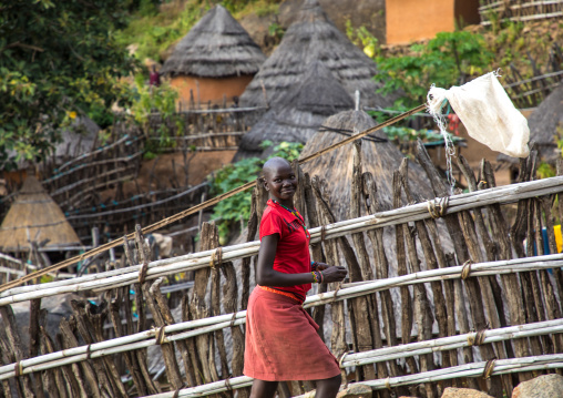 Girl in a Lotuko tribe village with thatched houses, Central Equatoria, Illeu, South Sudan