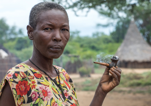 Portrait of a Larim tribe woman smoking a pipe, Boya Mountains, Imatong, South Sudan