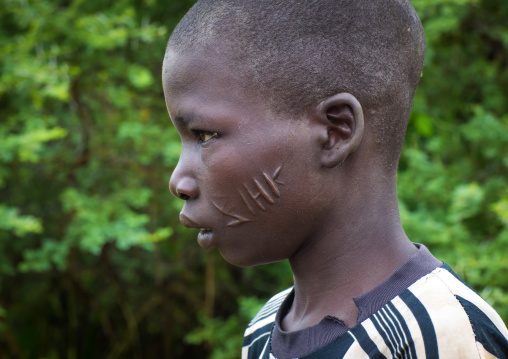 Larim tribe boy with scarifications on the cheek, Boya Mountains, Imatong, South Sudan