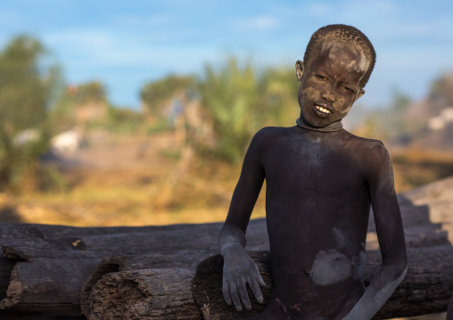 Mundari tribe boy covered in ash to protect from the mosquitoes and flies, Central Equatoria, Terekeka, South Sudan