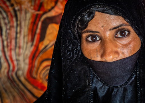 Portrait of a Rashaida tribe veiled woman inside her tent, Kassala State, Kassala, Sudan