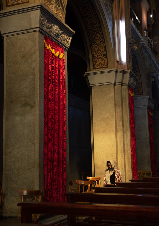 Woman praying inside st Matthew cathedral, Khartoum State, Khartoum, Sudan