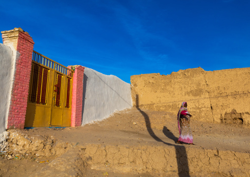 Sudanese woman coming out of her house, Northern State, Al-Khandaq, Sudan