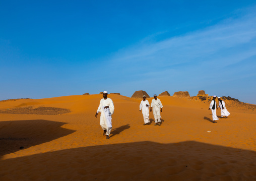 Sudanese tourists visiting the pyramids of the kushite rulers at Meroe, Northern State, Meroe, Sudan