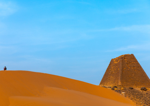 Tourist visiting the pyramids of the kushite rulers at Meroe, Northern State, Meroe, Sudan