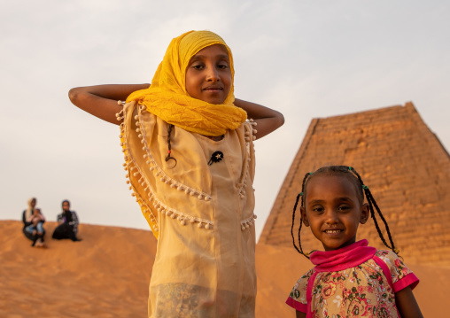 Portrait of sudanese girls visiting the pyramids of the kushite rulers at Meroe, Northern State, Meroe, Sudan