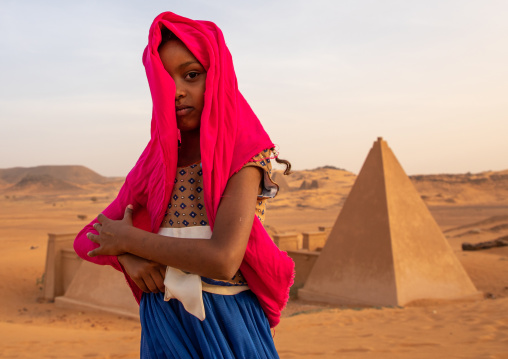 Portrait of sudanese girl visiting the pyramids of the kushite rulers at Meroe, Northern State, Meroe, Sudan