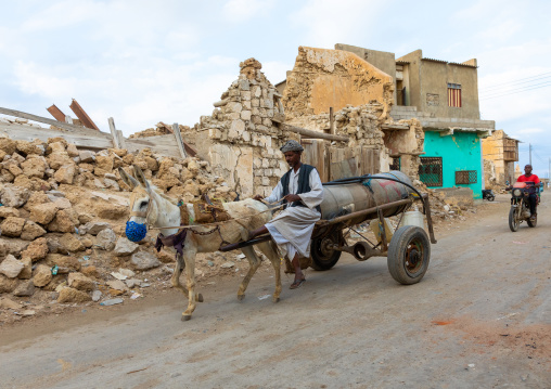 Sudanese man carrying water on a cart, Red Sea State, Suakin, Sudan