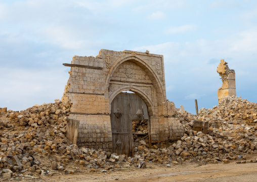 Wooden door in the middle of a ruined ottoman coral building, Red Sea State, Suakin, Sudan