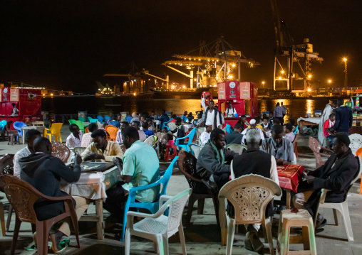 Sudanese men playing cards and dominos on the corniche, Red Sea State, Suakin, Sudan