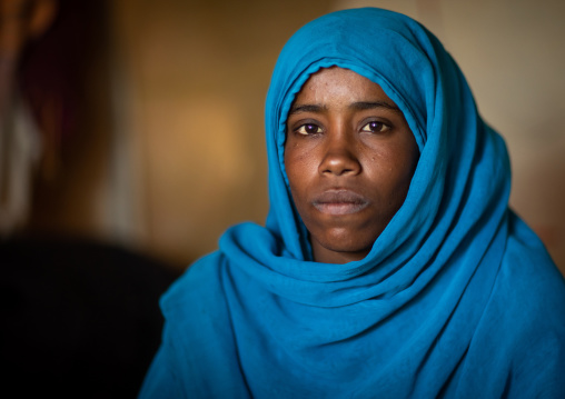 Portrait of a Beja tribe woman with a blue niqab, Red Sea State, Port Sudan, Sudan