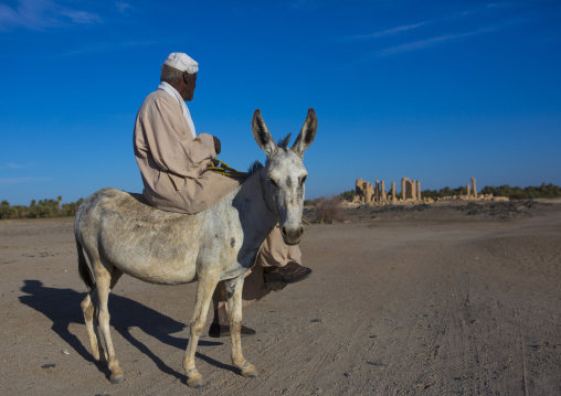 Sudan, Nubia, Soleb, man riding a donkey