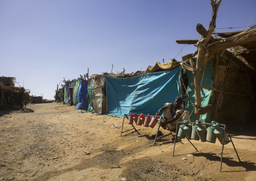 Sudan, Khartoum State, Alkhanag, man doing ablutions in the street